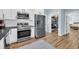 Well-appointed kitchen features stainless steel appliances, pantry and adjacent dining area at 119 White Picket Ln, Summerville, SC 29483