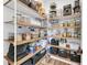 Organized pantry with wooden shelves, filled with various food items and storage containers at 119 White Picket Ln, Summerville, SC 29483