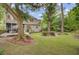 Expansive backyard featuring a deck, mature trees, and a well maintained lawn at 1200 Out Of Bounds Dr, Summerville, SC 29485