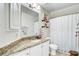 Bright bathroom features a granite vanity, new fixtures, and a shower-tub combo at 1200 Out Of Bounds Dr, Summerville, SC 29485