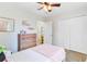 Bedroom features carpeted floors, a window, ceiling fan, and a large closet at 1200 Out Of Bounds Dr, Summerville, SC 29485