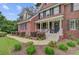 Attractive brick home with a covered porch and well-maintained landscaping creating a welcoming entrance at 1200 Out Of Bounds Dr, Summerville, SC 29485