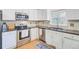 Well-lit kitchen featuring stainless steel appliances, granite countertops, and classic white cabinets at 1200 Out Of Bounds Dr, Summerville, SC 29485