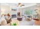 Bright living room features a fireplace, ceiling fan, and stylish furniture at 1200 Out Of Bounds Dr, Summerville, SC 29485