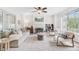 Bright living room features a fireplace, ceiling fan, and large windows at 1200 Out Of Bounds Dr, Summerville, SC 29485