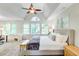 Spacious main bedroom with a ceiling fan, three windows, and neutral decor at 1200 Out Of Bounds Dr, Summerville, SC 29485