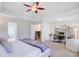 Main bedroom with a ceiling fan, a connected office space, and a walk-in closet at 1200 Out Of Bounds Dr, Summerville, SC 29485