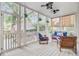 Inviting screened porch with comfortable seating, ceiling fans and views of backyard at 1200 Out Of Bounds Dr, Summerville, SC 29485