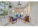 Relaxing screened porch featuring ceiling fans and comfortable outdoor furniture at 1200 Out Of Bounds Dr, Summerville, SC 29485