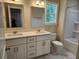 Bright bathroom featuring a double sink vanity with quartz countertops, and a shower with tub at 1207 Albert Storm Ave, Moncks Corner, SC 29461