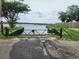 Gated waterfront access point with a view of the serene water and greenery beyond at 1207 Albert Storm Ave, Moncks Corner, SC 29461