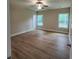 Inviting bedroom featuring a ceiling fan and well-lit by two large windows at 1207 Albert Storm Ave, Moncks Corner, SC 29461