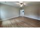Airy bedroom featuring laminate flooring, neutral walls, and abundant natural light at 1207 Albert Storm Ave, Moncks Corner, SC 29461