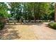Tranquil backyard featuring manicured landscaping, a pond, and mature trees at 125 Drayton Dr, Summerville, SC 29483
