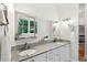 Bright bathroom with double sink vanity, granite countertop, and ample mirrors at 125 Drayton Dr, Summerville, SC 29483