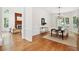 Bright dining room boasts hardwood floors, wainscoting, and an elegant chandelier at 125 Drayton Dr, Summerville, SC 29483
