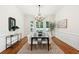 This dining room has wainscoting, a large bay window, and a decorative chandelier at 125 Drayton Dr, Summerville, SC 29483