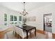 Bright dining room features a chandelier, bay window, and an adjacent view to another room at 125 Drayton Dr, Summerville, SC 29483