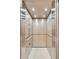 Modern elevator with wood-paneled walls and stainless steel accents at 125 Drayton Dr, Summerville, SC 29483