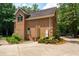Charming brick home featuring a side entrance, surrounded by lovely landscaping and greenery at 125 Drayton Dr, Summerville, SC 29483