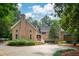 Stunning brick home featuring lush landscaping and a circular driveway at 125 Drayton Dr, Summerville, SC 29483