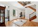 Welcoming foyer with wood staircase and elegant chandelier at 125 Drayton Dr, Summerville, SC 29483
