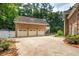 Spacious three-car garage with a large driveway, and well-maintained landscaping at 125 Drayton Dr, Summerville, SC 29483