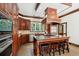 Gourmet kitchen features dark wood cabinetry, granite countertops, and stainless steel appliances at 125 Drayton Dr, Summerville, SC 29483