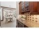 Open-concept kitchen with granite counters seamlessly connects to the dining and living areas at 125 Drayton Dr, Summerville, SC 29483