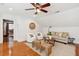 Bright living room with hardwood floors, neutral decor, and ceiling fan at 125 Drayton Dr, Summerville, SC 29483