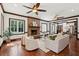 Comfortable living room with a brick fireplace and hardwood flooring at 125 Drayton Dr, Summerville, SC 29483