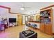 Open living space featuring wood accents and a ceiling fan, with a partial view of the kitchen area at 125 Drayton Dr, Summerville, SC 29483