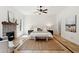 Spacious main bedroom with fireplace, tile floors, ceiling fan, and natural light at 125 Drayton Dr, Summerville, SC 29483