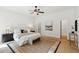 Bright main bedroom with neutral decor, ceiling fan, and comfortable furnishings at 125 Drayton Dr, Summerville, SC 29483