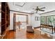 Bright office space with hardwood floors, built-in shelving, and a comfortable chair at 125 Drayton Dr, Summerville, SC 29483