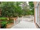 Lovely porch view showcasing the lush garden and tree-lined street at 125 Drayton Dr, Summerville, SC 29483