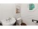 Elegant powder room with modern fixtures, unique sink, and wood-accented toilet at 125 Drayton Dr, Summerville, SC 29483