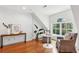 Inviting sitting area with hardwood floors, arched window, and comfortable seating at 125 Drayton Dr, Summerville, SC 29483