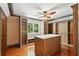 Spacious walk-in closet with custom shelving, drawers, and center marble top island at 125 Drayton Dr, Summerville, SC 29483