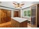 Spacious walk-in closet with custom shelving, drawers, and center marble top island at 125 Drayton Dr, Summerville, SC 29483