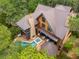 Aerial view of the stunning property with a pool, outdoor kitchen, and lush surroundings at 127 Blue Heron Pond Rd # C, Kiawah Island, SC 29455