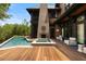 Beautiful backyard featuring a pool, spa, fireplace, and comfortable seating, perfect for outdoor entertaining at 127 Blue Heron Pond Rd # C, Kiawah Island, SC 29455