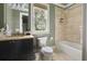 Stylish bathroom featuring a bathtub, shower, elegant vanity, and a large window with scenic views at 127 Blue Heron Pond Rd # C, Kiawah Island, SC 29455
