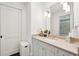 Bathroom featuring a sink vanity with a large mirror and decor at 127 Blue Heron Pond Rd # C, Kiawah Island, SC 29455