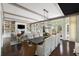 Elegant dining room with an open floor plan, flowing into a comfortable living area with a fireplace at 127 Blue Heron Pond Rd # C, Kiawah Island, SC 29455