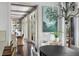 Open concept dining area featuring hardwood floors, chandelier, and seamless flow into the living area at 127 Blue Heron Pond Rd # C, Kiawah Island, SC 29455