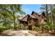 Beautiful exterior view of a two-story home featuring lush landscaping and a welcoming front entrance at 127 Blue Heron Pond Rd # C, Kiawah Island, SC 29455