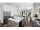 Bright, spacious kitchen features stainless steel appliances and a large center island with seating at 127 Blue Heron Pond Rd # C, Kiawah Island, SC 29455