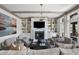 Inviting living room featuring a fireplace, built-in shelving, and plenty of comfortable seating at 127 Blue Heron Pond Rd # C, Kiawah Island, SC 29455