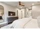Comfortable main bedroom featuring hardwood floors, modern furnishings and TV at 127 Blue Heron Pond Rd # C, Kiawah Island, SC 29455
